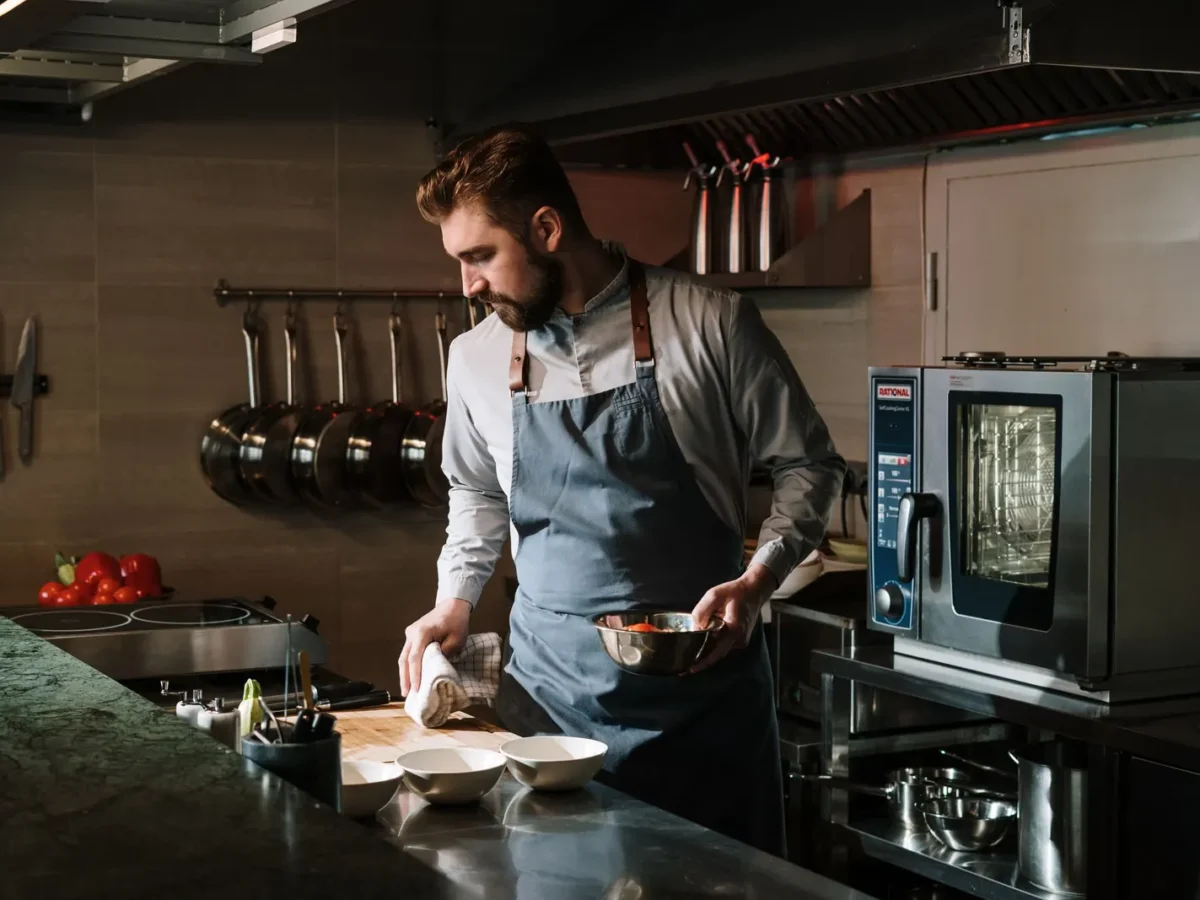 Chef preparing a dish in a restaurant kitchen