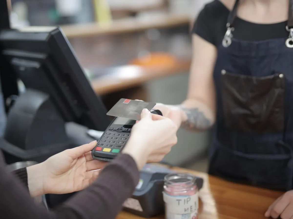 Customer paying at a shop counter