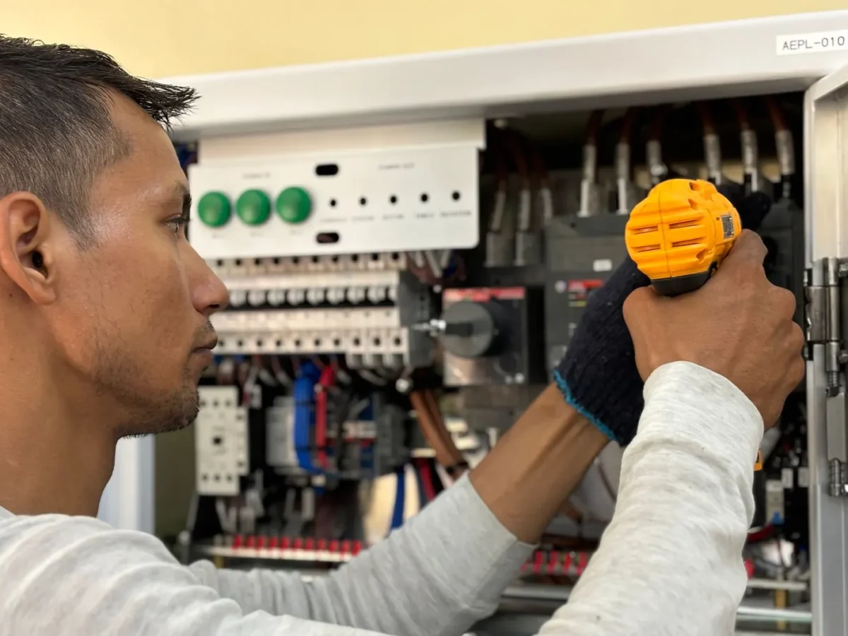 Electrician testing an electrical panel