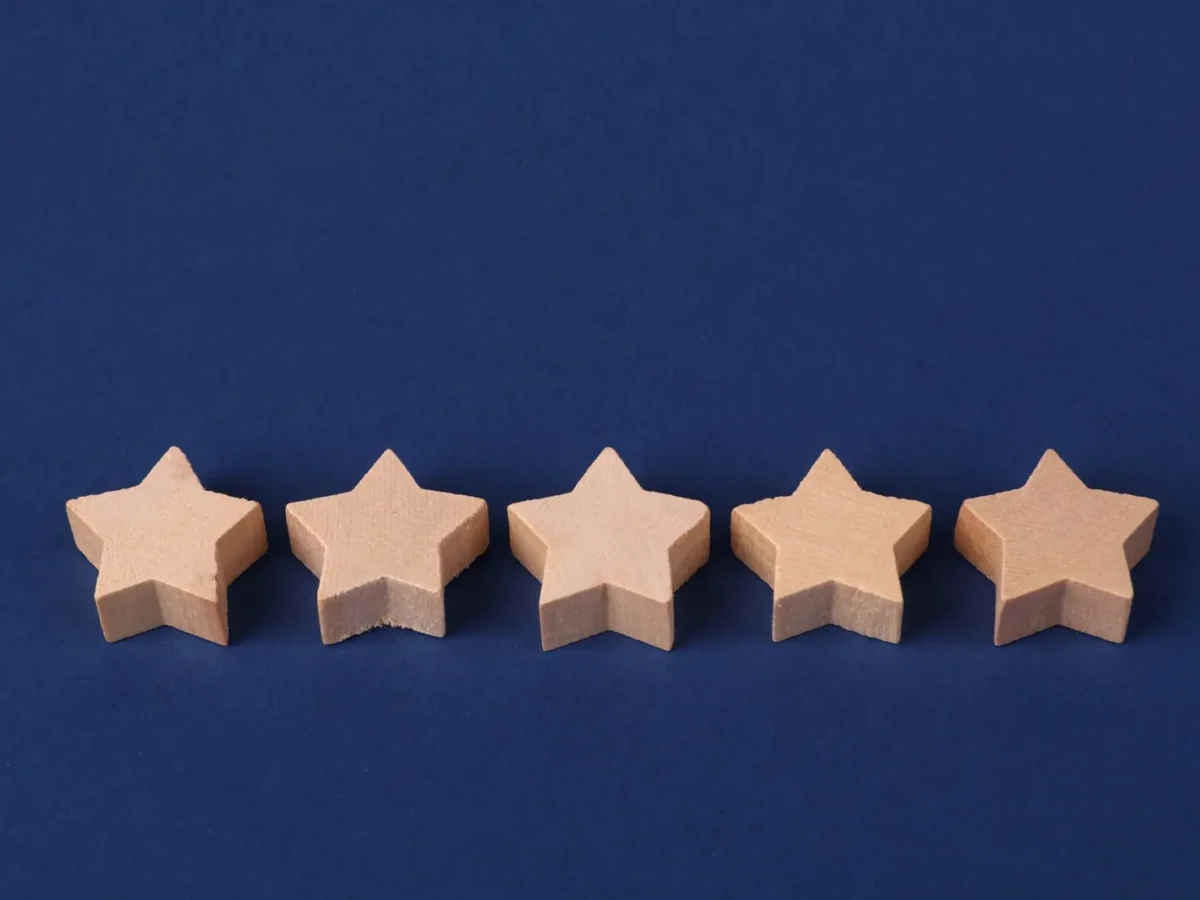 Five wooden stars on a blue background