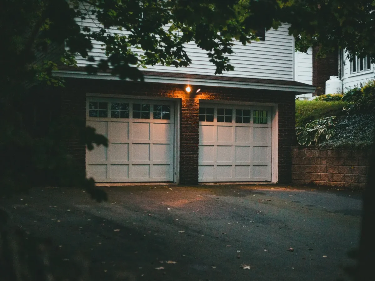 Double garage doors on a house at dusk