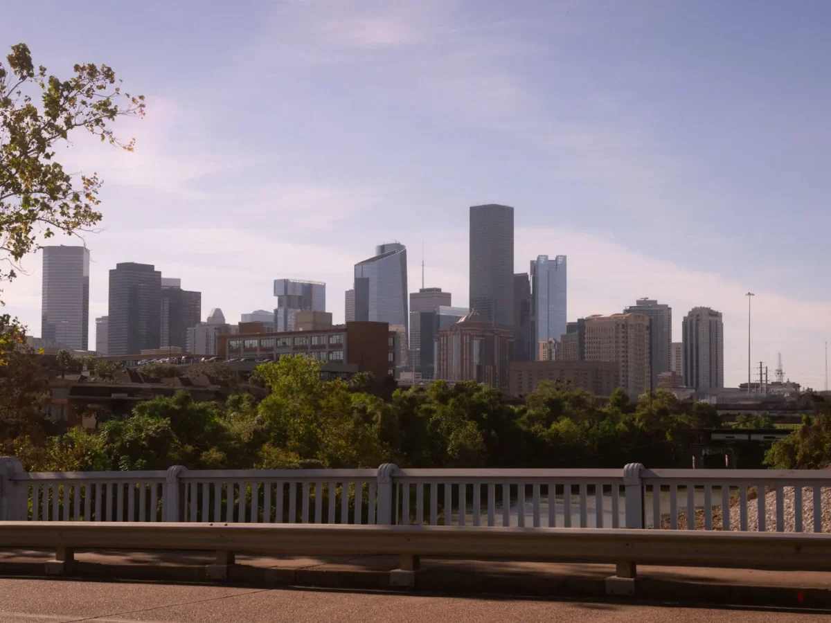 Downtown Houston skyline above the trees