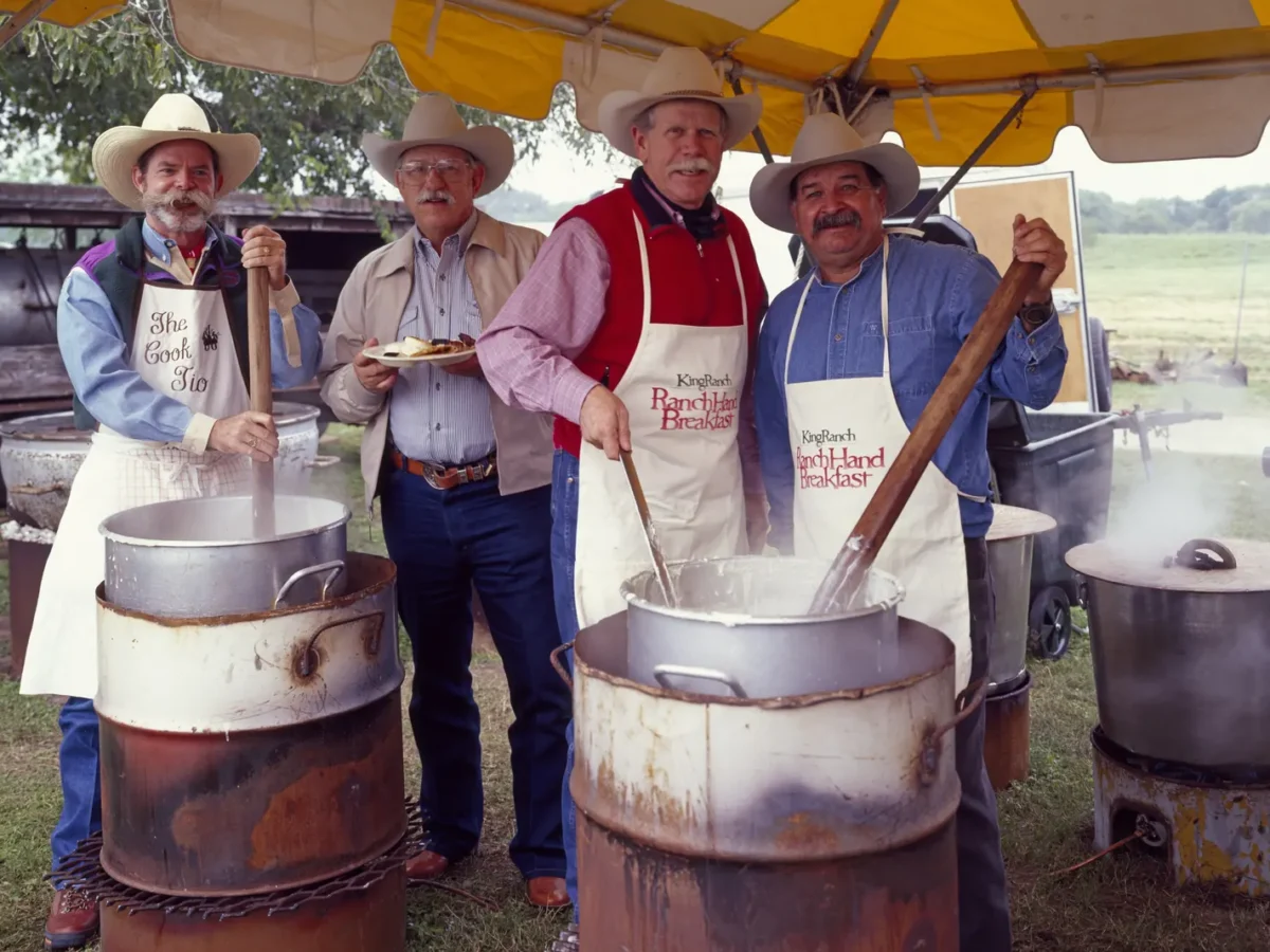 Cowhands preparing breakfast at the King Ranch in Kingsville, Texas
