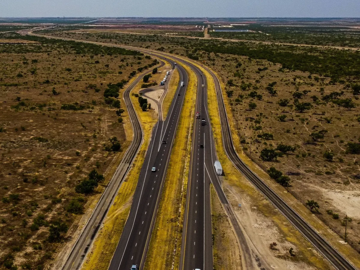 Aerial view of a highway crossing the dry landscape near Midland, Texas