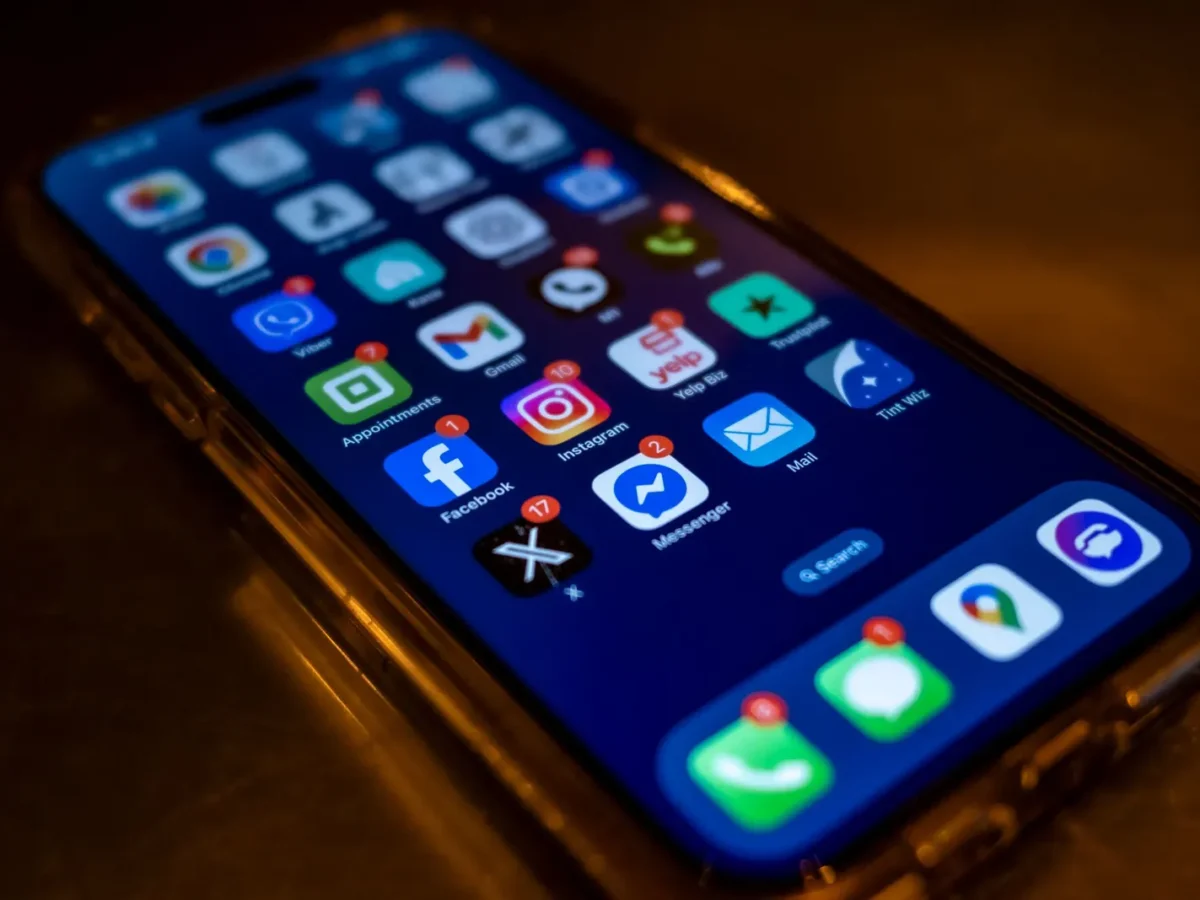 Phone home screen with app notification badges