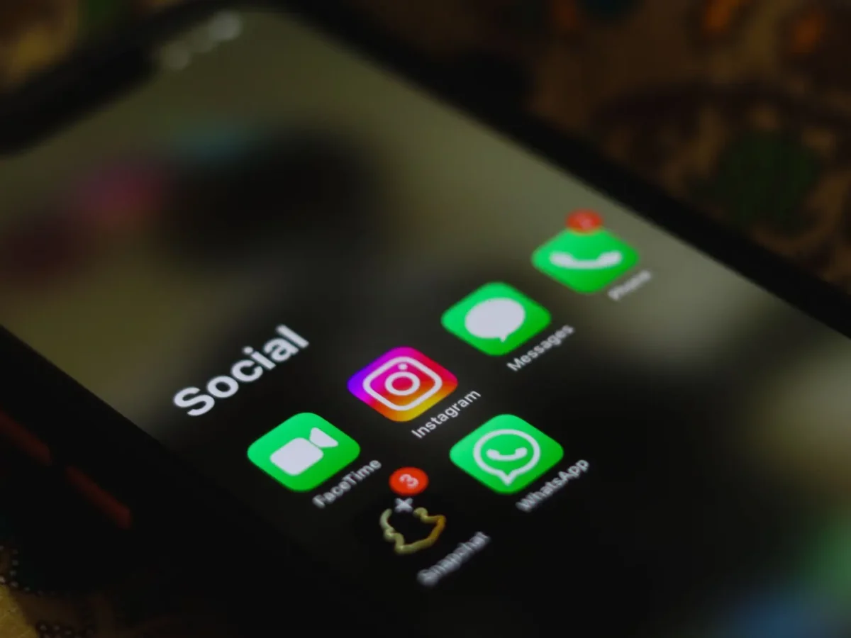 Phone with a folder of social media apps