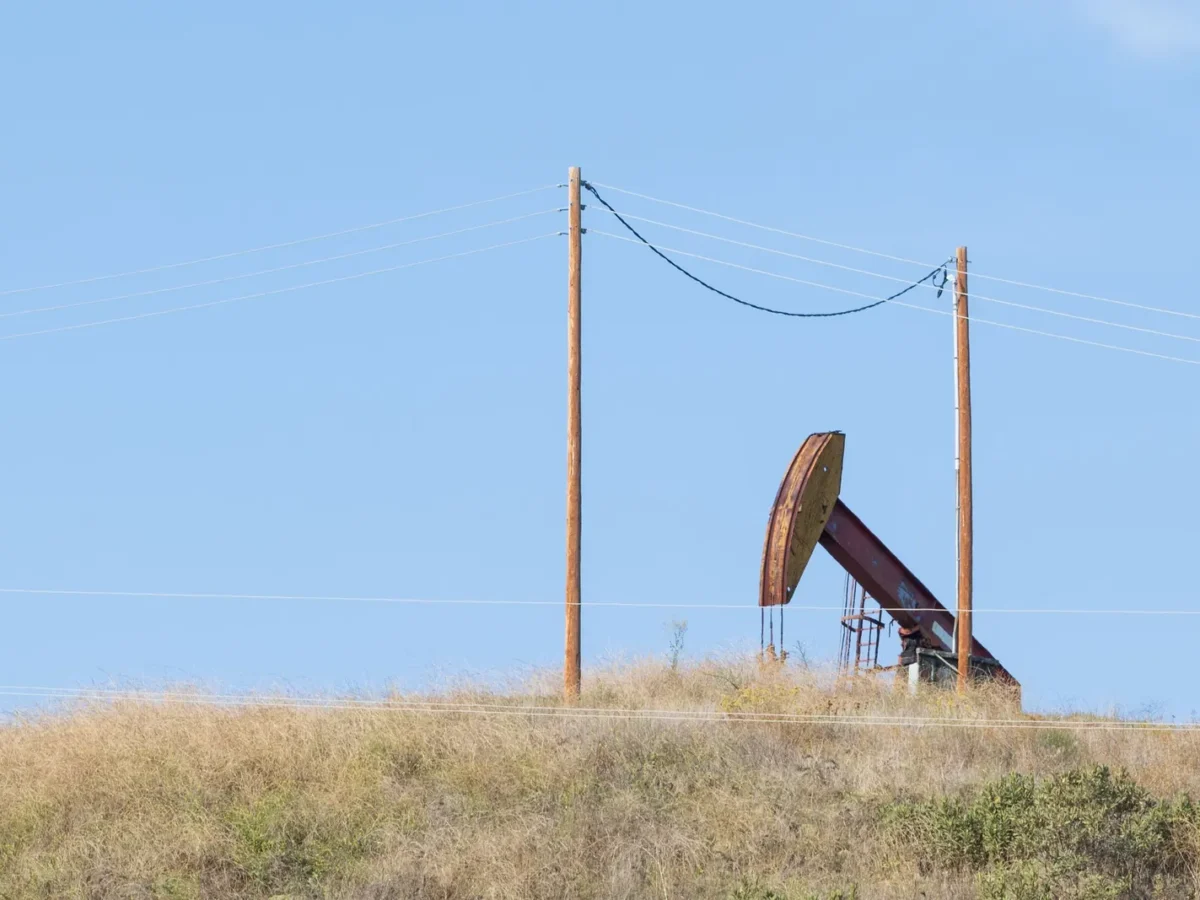 Oil pumpjack under a blue sky